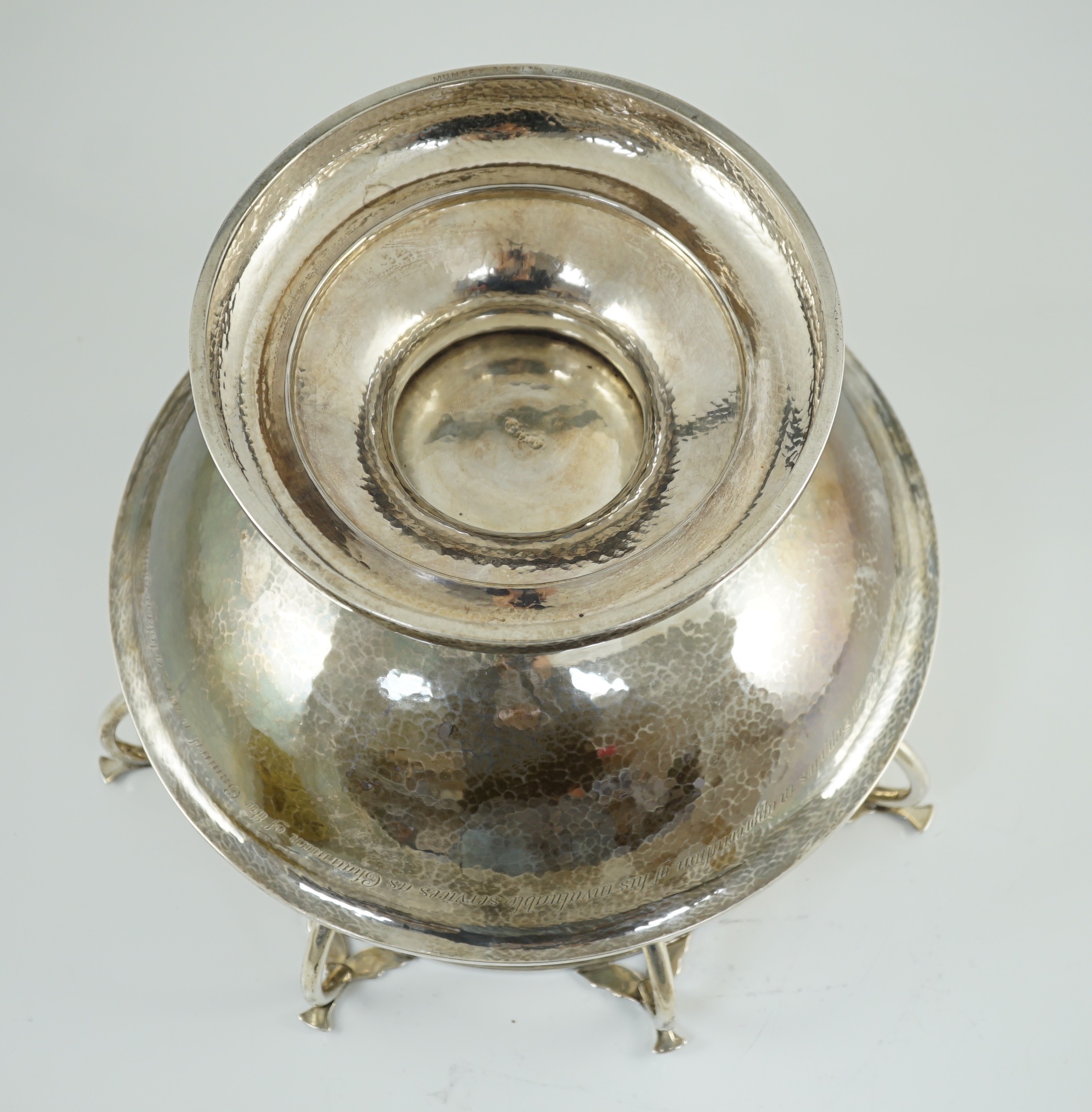 A George V Arts & Crafts planished silver octuple handled pedestal punch bowl, by Albert Edward Jones